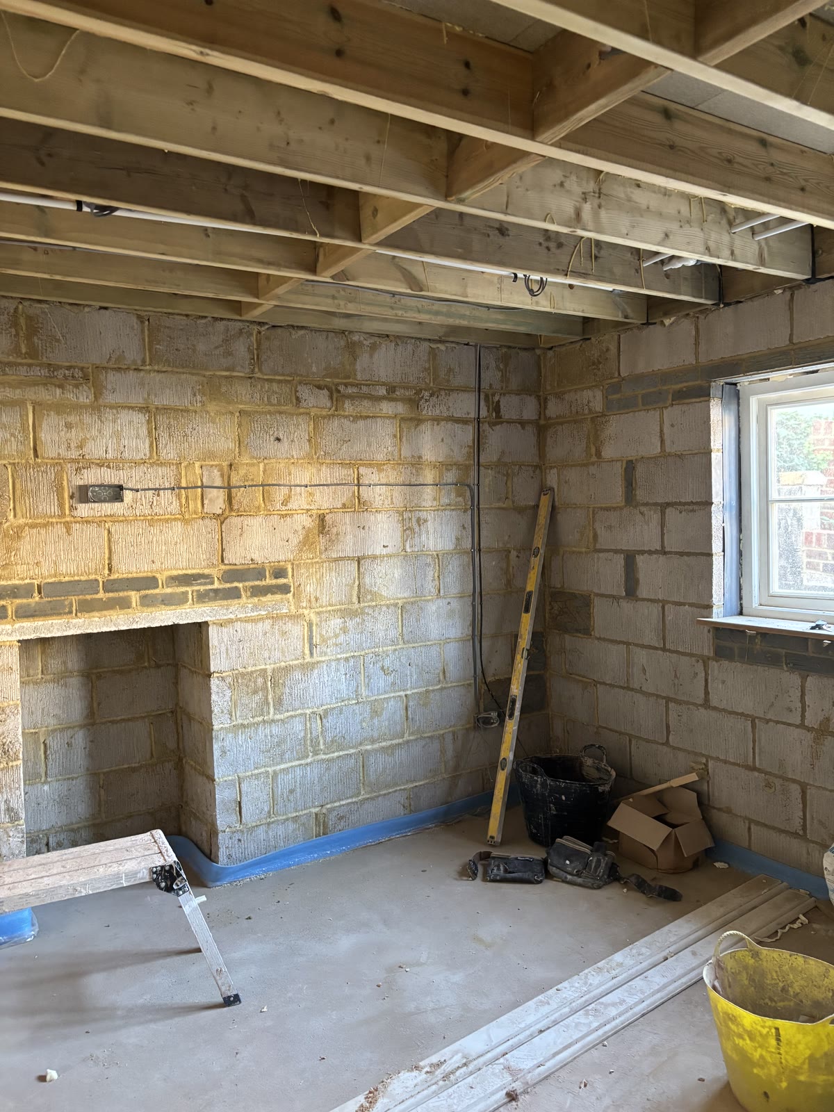 Blockwork room with open ceiling joists