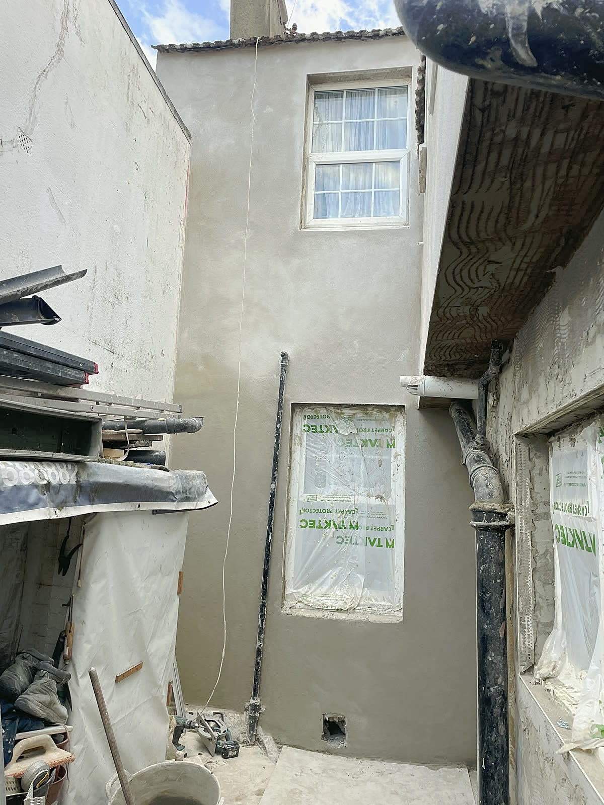 Float coat on a courtyard wall